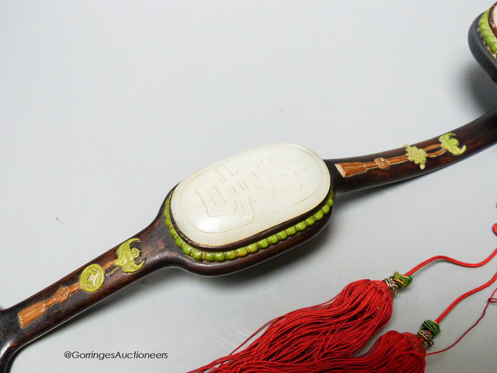 A Chinese jade and bone mounted zitan ruyi sceptre, 19th century, 38.5cm long, small losses to bone